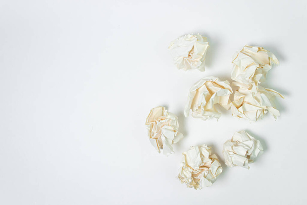 Crumpled paper on a white background. A pile of crumpled paper. Creative crisis. Lack of ideas - Photo, Image