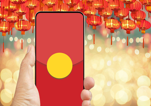 The digital hongbao on cell phone in chinese lunar new year. - Photo, Image