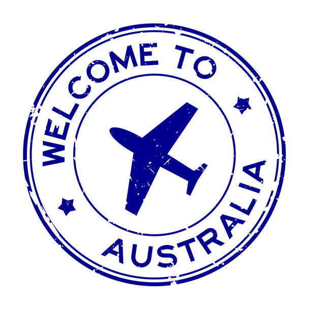 Grunge kék üdvözöljük Ausztráliában szó repülőgép ikon kerek gumi pecsét fehér háttér - Vektor, kép