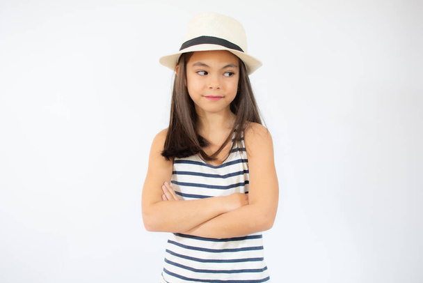 Enjoying vacation. Good vibes. Beach style. Little beauty in straw hat. Portrait of happy cheerful girl in summer hat over white background. - Foto, Imagen