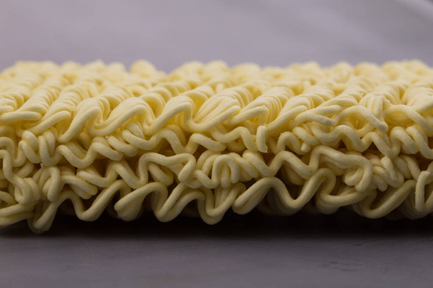 dried instant noodles, isolated on gray background. - Photo, Image