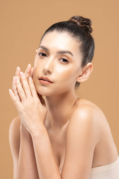 Beautiful Glamour woman holding hands smile with clean and fresh skin Happiness and cheerful with positive emotional,isolated on Beige background,Beauty Cosmetics and spa Facial treatment Concept - 写真・画像
