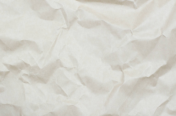 Ιστορικό από τσαλακωμένο μπεζ χαρτί. Υφή από τσαλακωμένο χαρτί - Φωτογραφία, εικόνα
