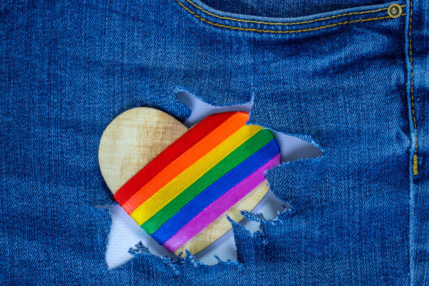 Heart with LGBT symbols on the background of washed jeans. Background for Valentine's Day - Photo, Image