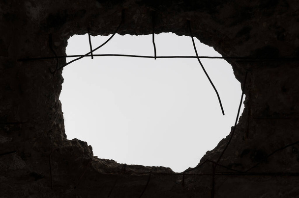 Hole in the ceiling.Consequences of war. - Photo, Image