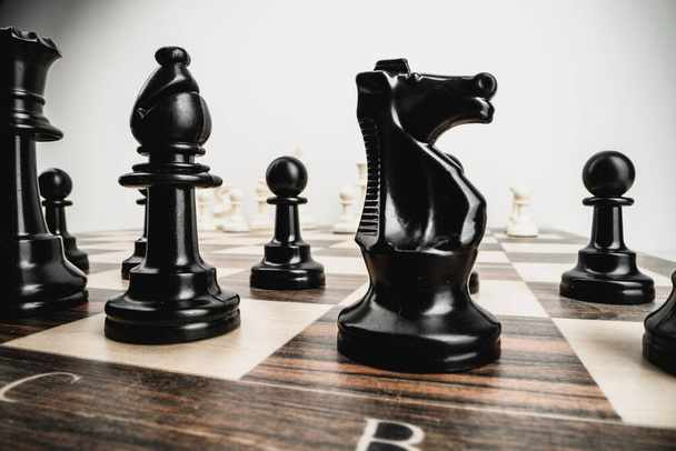 Macro photo of chess pieces on a chess board - Фото, изображение