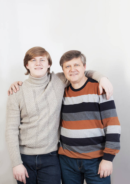 smile mature father and young son on white background  - Fotografie, Obrázek