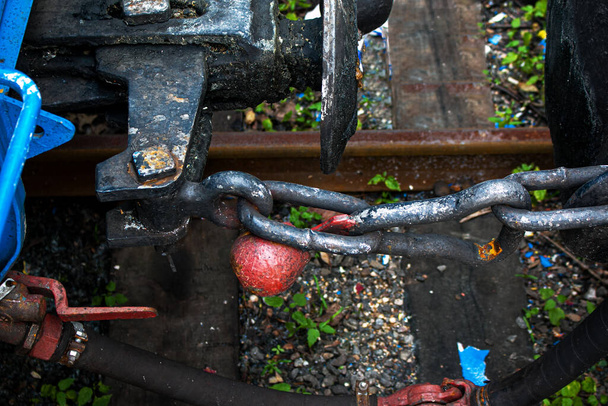 Wagon coupling mechanism. Coupling of carriages on the children's railway from the Soviet era in the park. - Photo, Image