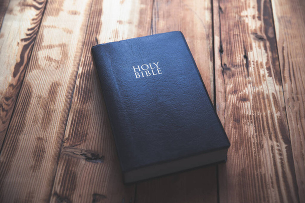 Holy Bible on the wooden table backgroun - Zdjęcie, obraz