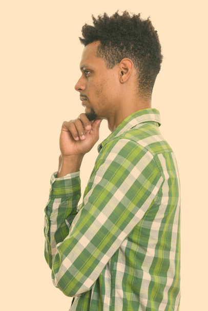 Profile view of young African man thinking - Photo, Image
