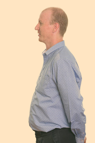 Profile view of businessman with hands on back - Foto, immagini