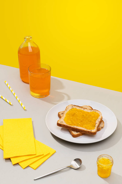 Delicious toast with lemon jam on gray background - Photo, Image