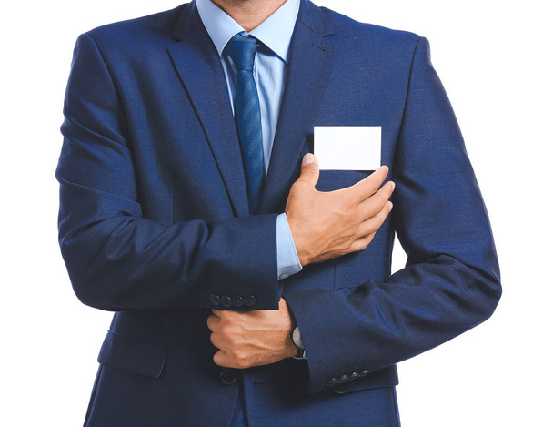 Elegant man in suit with blank badge on white background - Fotografie, Obrázek