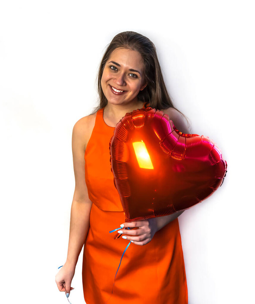 Happy Valentine's day! Young woman with a balloon in the form of a heart - Foto, Imagem