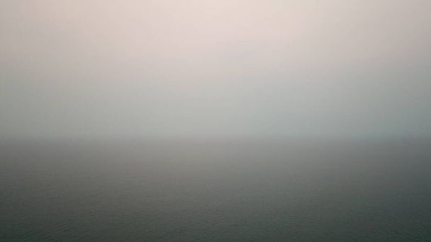 Thailands sea is in smoke due to a fire. - Photo, Image