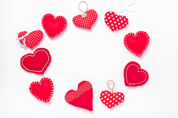 Frame of red textile hearts on white background. The concept of Valentine Day - Fotoğraf, Görsel