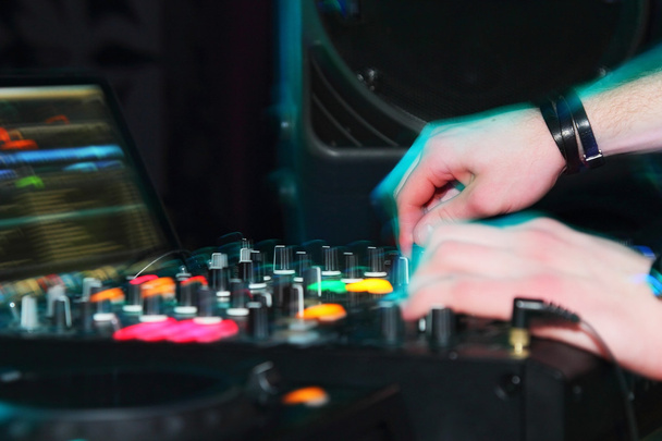 DJ hands on sound equipment - Foto, afbeelding