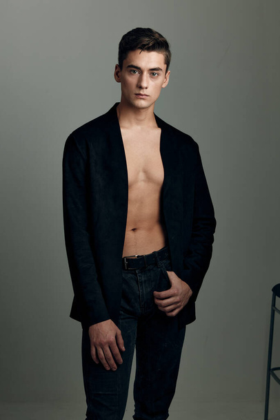 Handsome man black jacket nude torso fashion lifestyle isolated - Photo, image