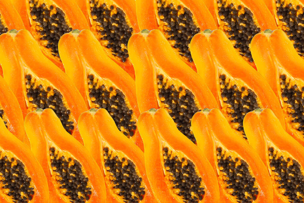 Slices of papaya as textured background, close up and top of view. - Фото, изображение