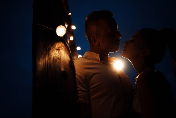 young couple in love at night - Фото, зображення
