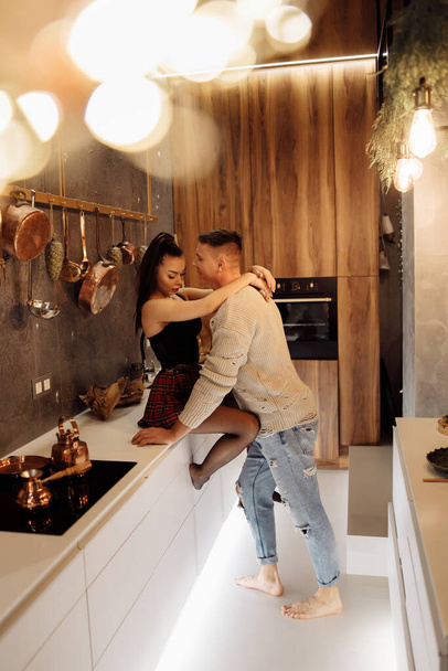 young couple in love  on kitchen  - Φωτογραφία, εικόνα