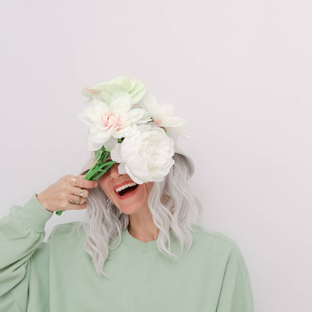 Fashion happy blonde girl wearing trendy bucket hat and cotton hoodie.  Fresh Aqua menthe monochrome colours.  Eco Comfort Street style concept. Spring summer seasons - Foto, Bild
