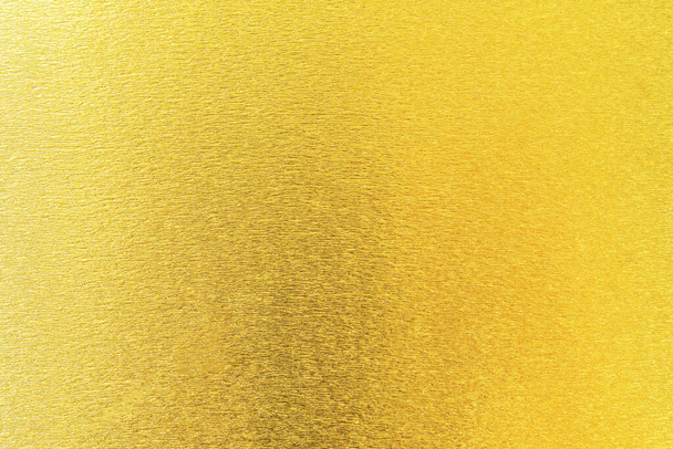 Kulta rakenne tausta metallinen kultainen folio tai kiiltävä käärepaperi kirkkaan keltainen seinäpaperi sisustuselementti - Valokuva, kuva
