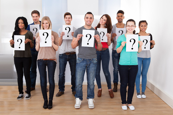 College Students Holding Question Mark Signs - Foto, imagen