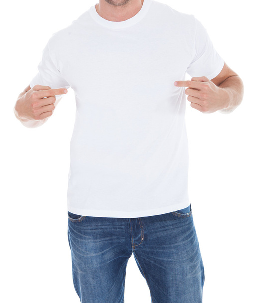 Man pointing at his blank white t-shirt - 写真・画像
