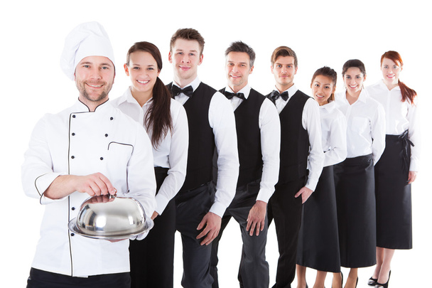 Large group of waiters and waitresses standing in row - Foto, Imagem