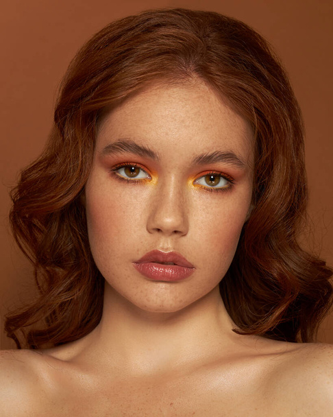 Beautiful young girl unusual Makeup Face Skin Care. Lifting Procedure. Cosmetology Salon. Cosmetology Face Massage. Spa Closeup. Fashion Art Freckles - 写真・画像