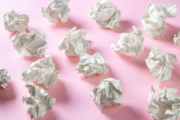 Crumpled paper on a pink background. A pile of crumpled paper. Creative crisis. Lack of ideas - Photo, image