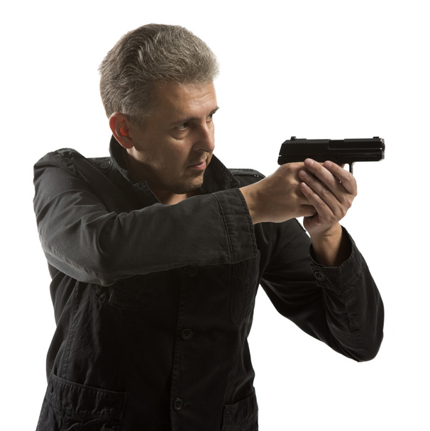 Man holding gun isolated  - Foto, Bild