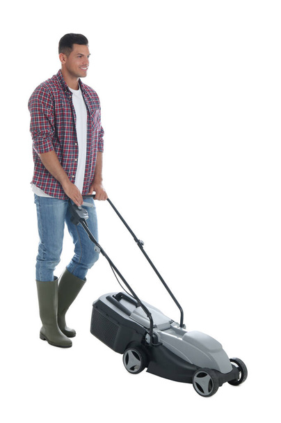 Man with modern lawn mower on white background - Foto, imagen