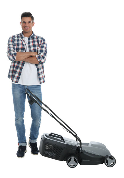 Man with modern lawn mower on white background - Foto, Imagen