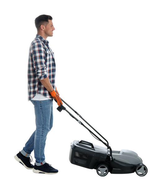 Man with modern lawn mower on white background - Photo, image