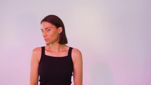 girl on a pink background posing - Footage, Video
