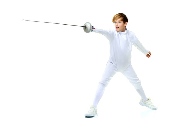 Fencer boy practicing effective technique - Fotó, kép
