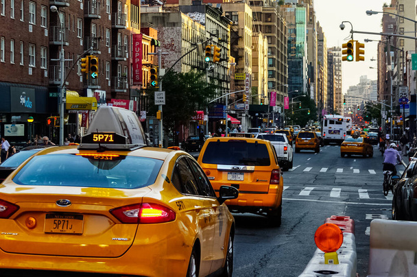 New York City Manhattan street panorama with yellow New York City taxi cabs on the streets. Manhattan, New York. - Φωτογραφία, εικόνα