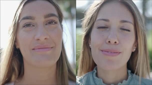 Zwei nebeneinander liegende Nahaufnahmen von zwei schönen jungen kaukasischen Frauen, die im Freien in die Kamera schauen und dann trotz des Unbehagens, es zu tun, eifrig eine Pandemie-Schutzmaske tragen - Filmmaterial, Video