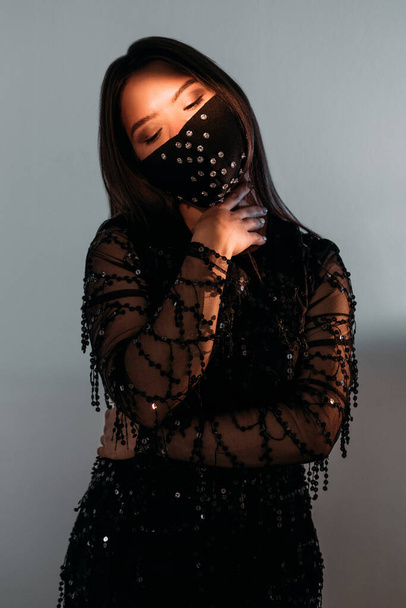 beautiful woman pandemic fashion black party - Foto, Imagen