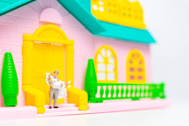 Miniature people , Couple standing together in front of their house, valentines day concept - Photo, Image