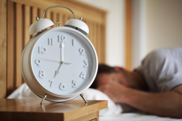 Man sleeping with alarm clock - Φωτογραφία, εικόνα