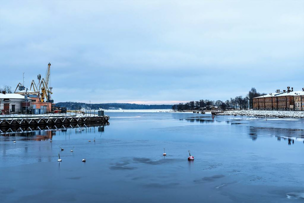 Russia, Vyborg, January 2021. View of the bay and port facilities on a winter day. - Fotoğraf, Görsel