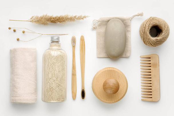 Towel, body scrub, soap, wooden comb, beech toothbrushes, sea bath salt, body brush and other spa objects on light background.Top view, Flat lay. Skin care, body treatment concept.Knolling composition. - Photo, Image