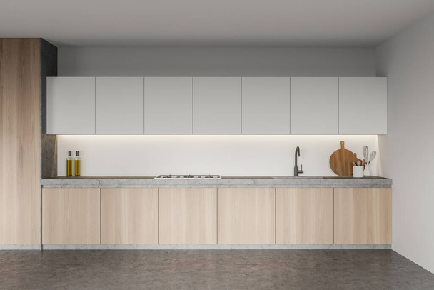 Interior of stylish kitchen with white walls, concrete floor and wooden cupboard. 3d rendering - Fotoğraf, Görsel