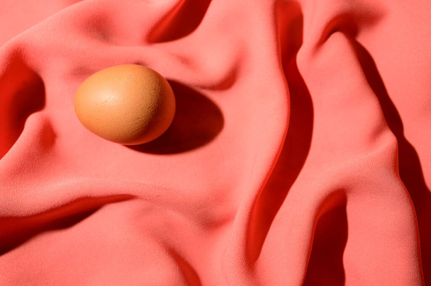 fresh egg on textile background, close view  - Fotografie, Obrázek