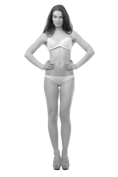 young woman with slender body posing in underwear - Fotoğraf, Görsel