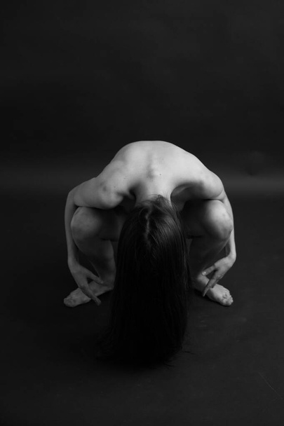 Black and white photo of a naked female body, geometry and plastic of the body. Close-up details and poses of the human body - Photo, Image