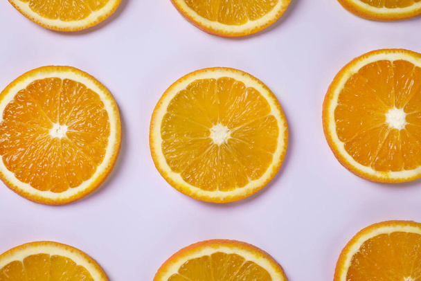 Fresh orange slices on light background, flat lay - Φωτογραφία, εικόνα